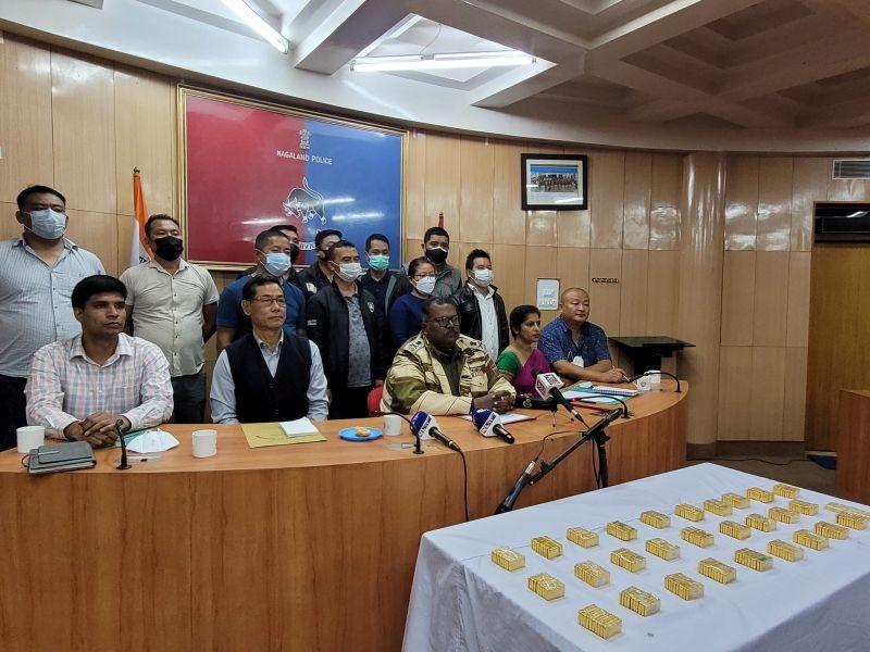 Nagaland Police officials with the smuggled gold during a press conference in Kohima on October 4. (Morung Photo)